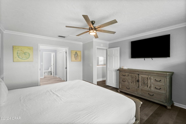 bedroom featuring ceiling fan, dark wood-style flooring, visible vents, attic access, and crown molding