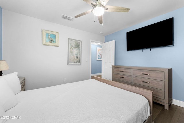 bedroom with a ceiling fan, baseboards, visible vents, and dark wood-style flooring