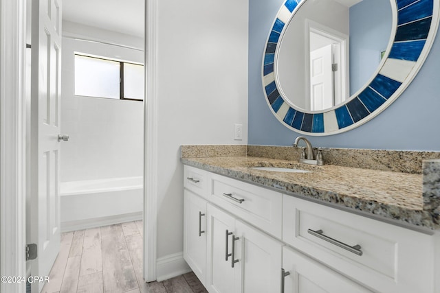 bathroom with vanity and wood-type flooring