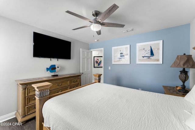 bedroom featuring dark hardwood / wood-style floors and ceiling fan