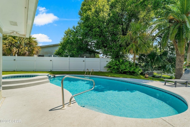 view of pool featuring an in ground hot tub and a patio area