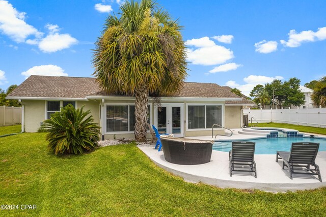 view of pool with an in ground hot tub and a patio