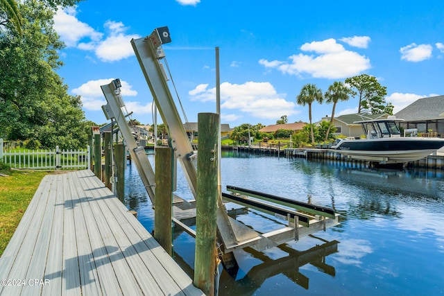 dock area featuring a water view and boat lift