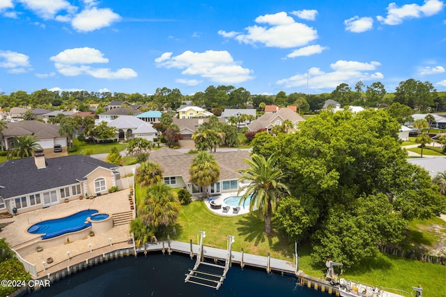 aerial view featuring a residential view and a water view