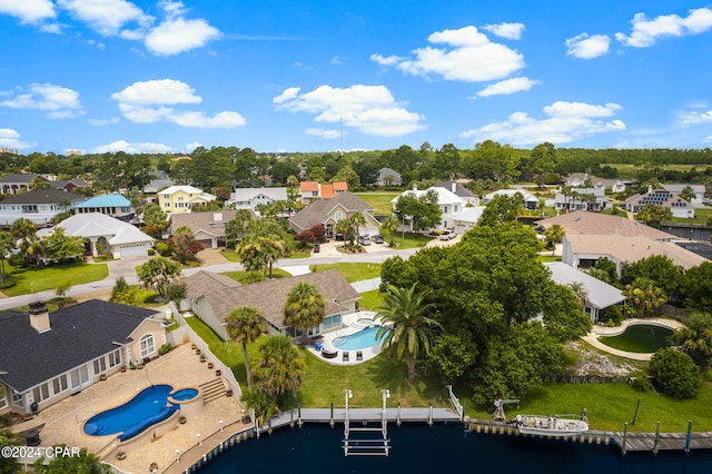 bird's eye view with a water view and a residential view