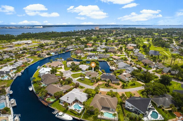 birds eye view of property with a water view