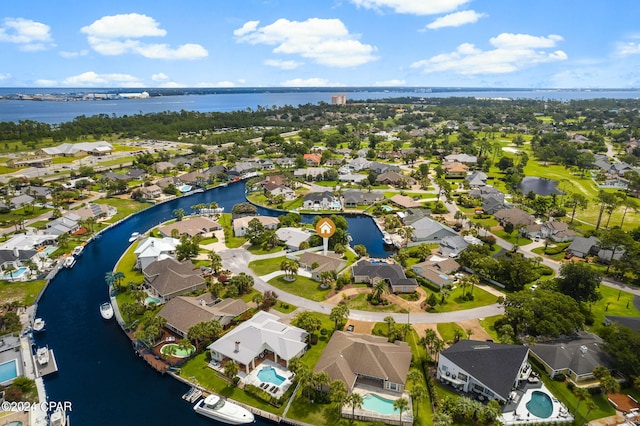 birds eye view of property featuring a water view and a residential view