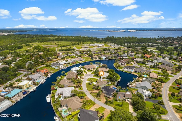 birds eye view of property with a residential view and a water view