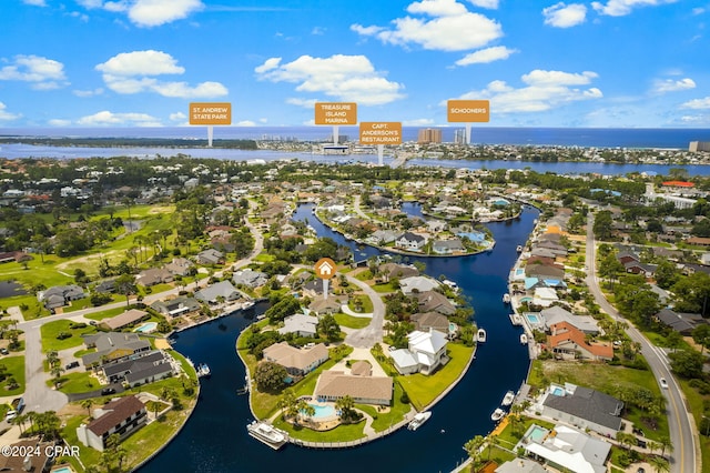 birds eye view of property featuring a water view and a residential view