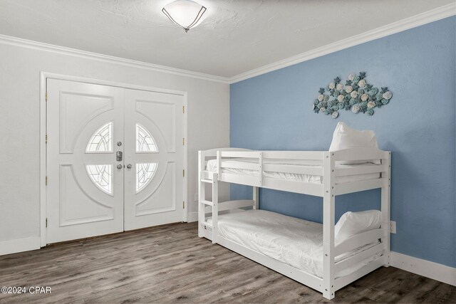 interior space with crown molding, hardwood / wood-style flooring, and a closet