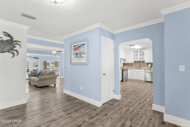 hall featuring crown molding and hardwood / wood-style floors