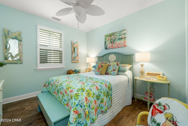 bedroom with ceiling fan and dark hardwood / wood-style floors