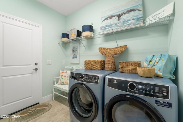 clothes washing area with washer and dryer