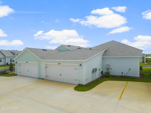 view of side of home featuring a garage