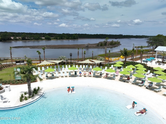 view of swimming pool featuring a water view