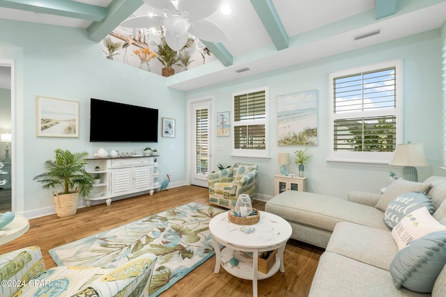 living room with beam ceiling, ceiling fan, and hardwood / wood-style floors