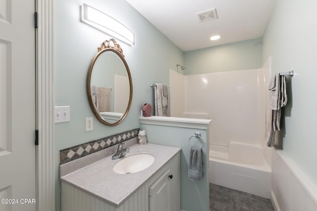 bathroom with shower / bathing tub combination, vanity, and tile patterned flooring