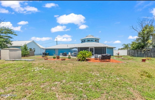 back of property featuring a lawn