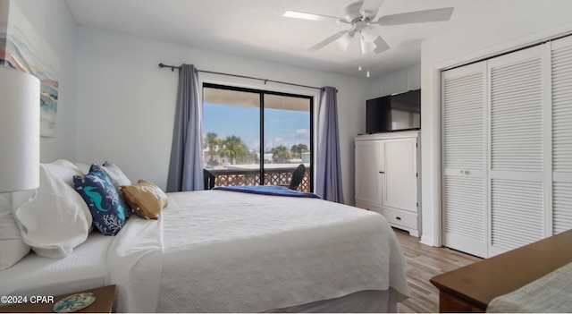 bedroom with access to outside, a closet, wood finished floors, and a ceiling fan