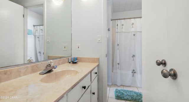 full bathroom with shower / tub combo, tile patterned flooring, and vanity