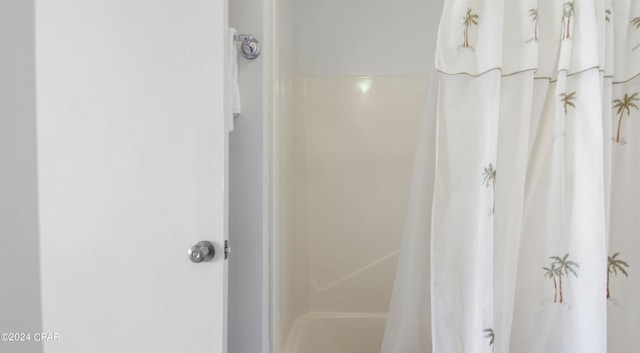 bathroom with a shower with shower curtain