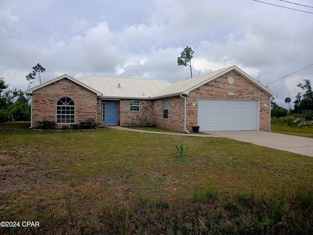 single story home featuring a front yard and a garage