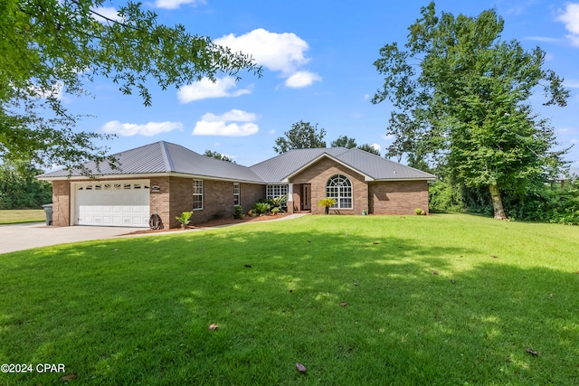 single story home featuring a front yard and a garage