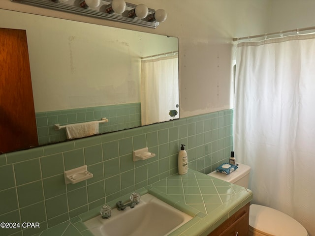 bathroom featuring vanity, tile walls, toilet, and a shower with shower curtain