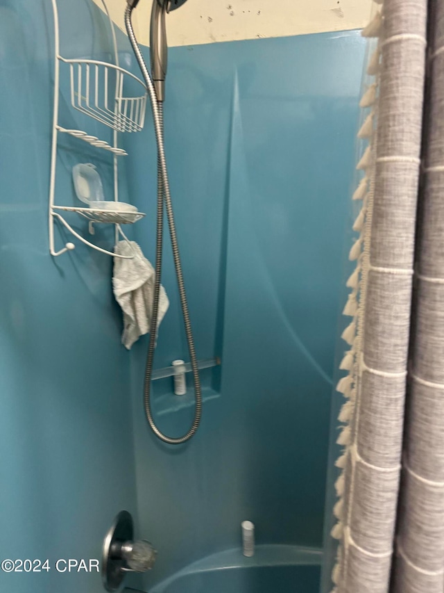 interior details featuring curtained shower