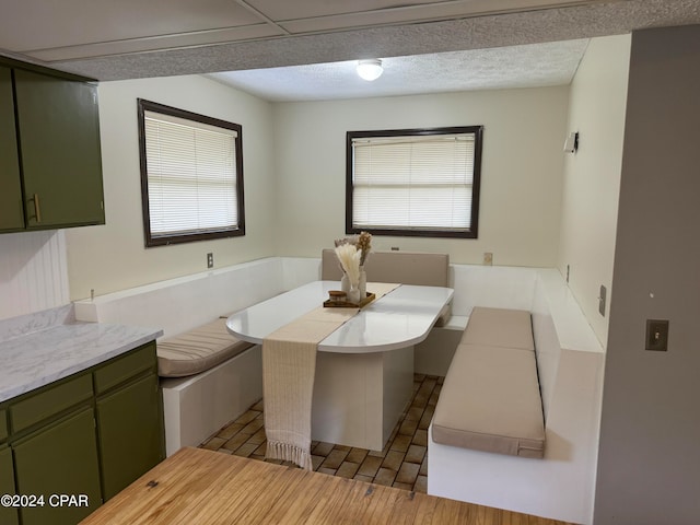 bathroom featuring vanity, hardwood / wood-style flooring, breakfast area, and a textured ceiling