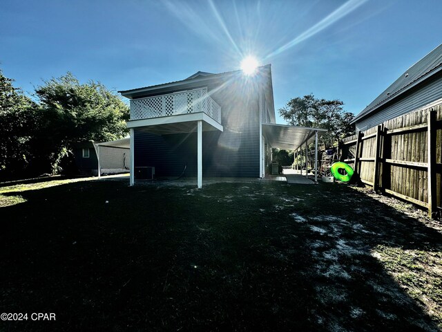 rear view of property with a patio area and a lawn