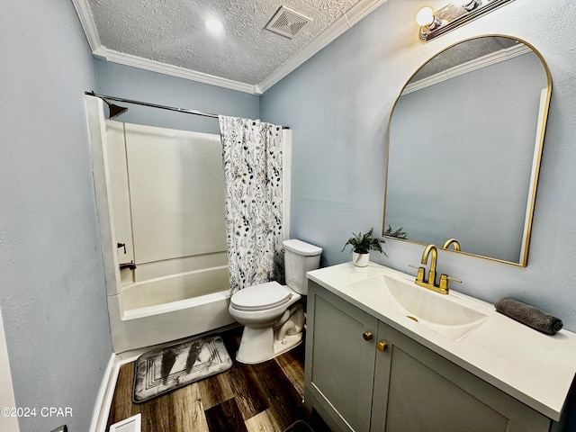 full bathroom with shower / bath combo with shower curtain, a textured ceiling, toilet, vanity, and hardwood / wood-style flooring