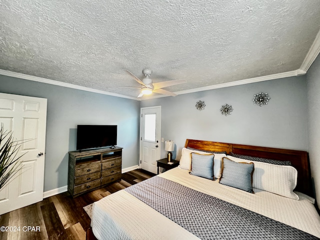 bedroom with dark wood-type flooring, a textured ceiling, crown molding, and ceiling fan