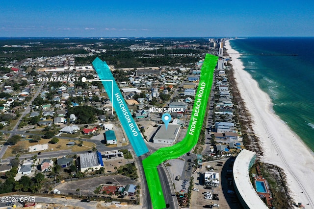 drone / aerial view featuring a view of the beach and a water view