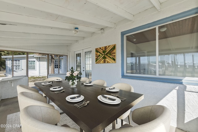 sunroom / solarium with french doors and lofted ceiling with beams