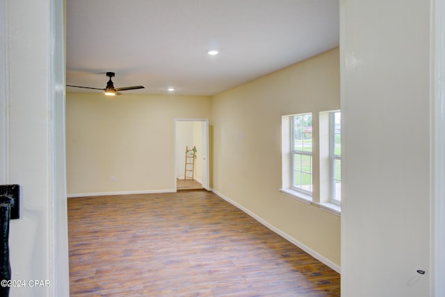 unfurnished room featuring ceiling fan and light hardwood / wood-style floors