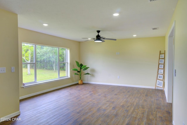 unfurnished room with ceiling fan and hardwood / wood-style flooring