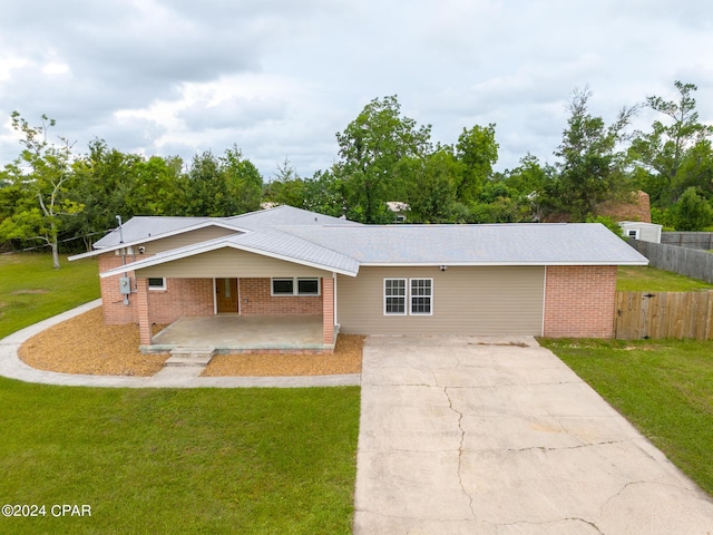 ranch-style home with a front lawn