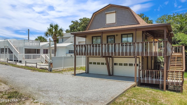 view of front facade with a garage and a porch