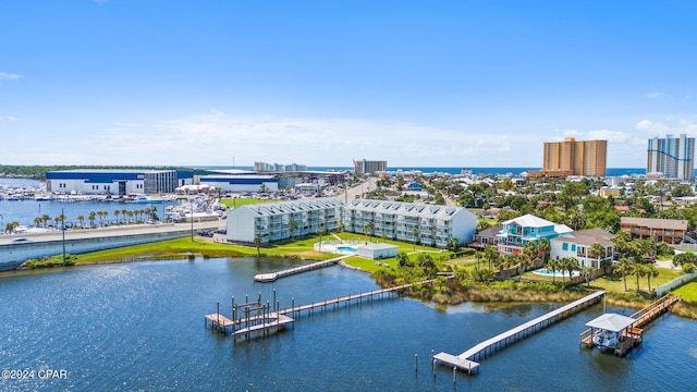 birds eye view of property with a water view and a view of city