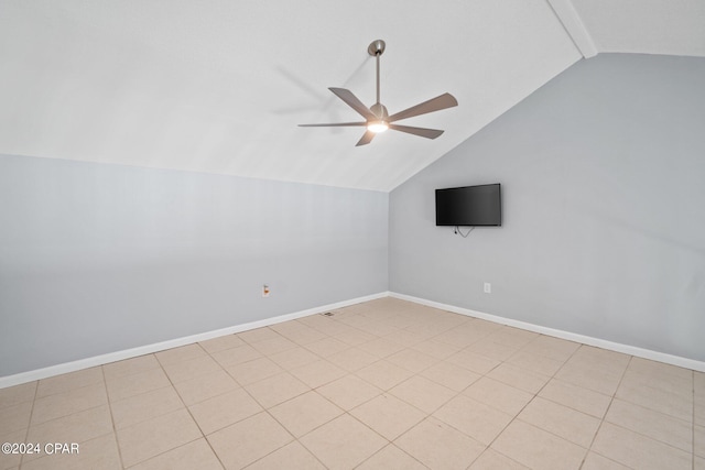 additional living space featuring ceiling fan, light tile patterned floors, and vaulted ceiling