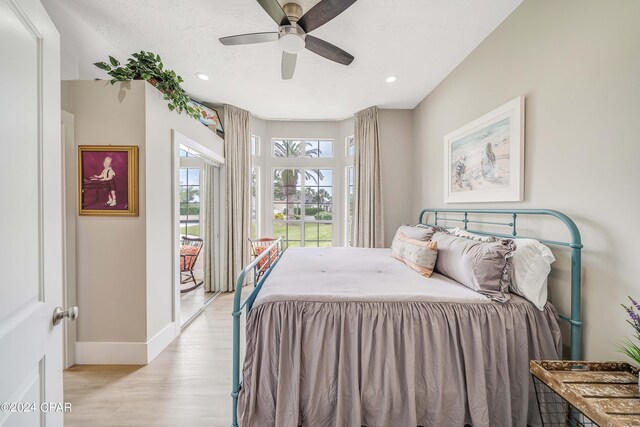 bedroom with ceiling fan, recessed lighting, light wood-type flooring, and baseboards