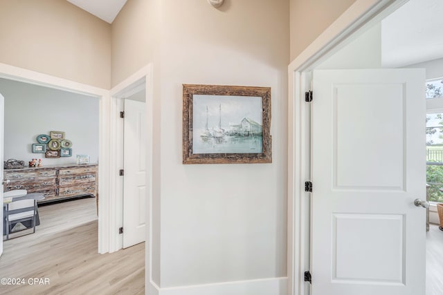 corridor with light wood-style floors