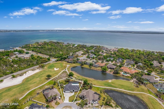 bird's eye view featuring a water view, a residential view, and golf course view