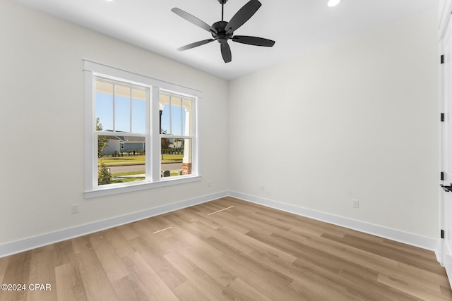 unfurnished room with ceiling fan and light hardwood / wood-style flooring