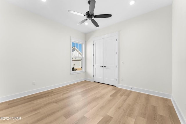 unfurnished bedroom featuring light hardwood / wood-style floors and ceiling fan