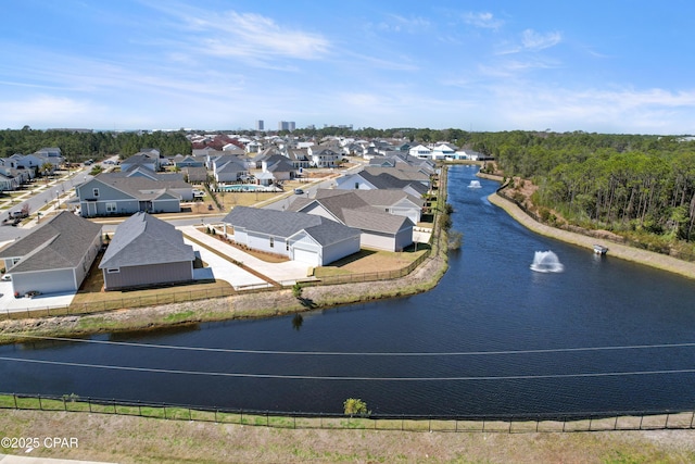 birds eye view of property featuring a water view and a residential view