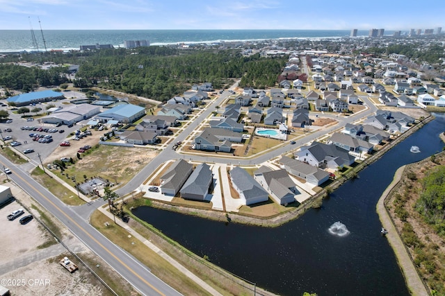 birds eye view of property with a residential view and a water view