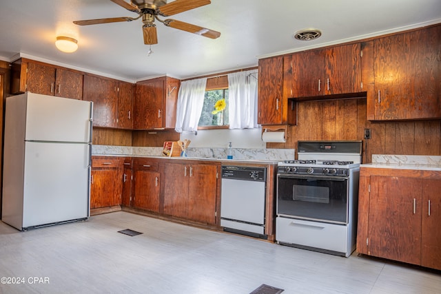 kitchen featuring white appliances and ceiling fan