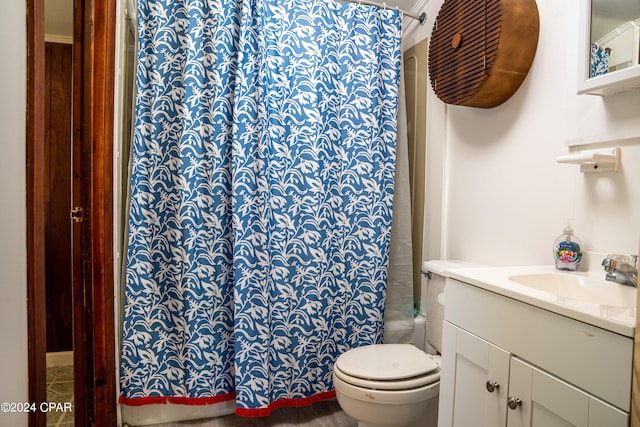 full bathroom with shower / tub combo with curtain, vanity, and toilet